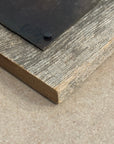 Close-up of a wooden frame corner on a neutral background