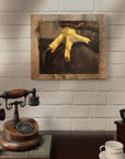Vintage wooden telephone and coffee grinder on a table with a framed painting of a bird's foot by Kris Horton above.