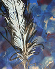 Close up detail of the painting 'A Feathered Thought' where you can see the brush strokes and the metallic paint.