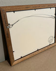 Back of wooden framed original painting by Kris Horton with wire hanger