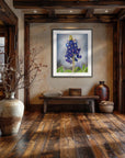 Framed floral painting by Kris Horton of Texas Bloom No. 1 hanging in a rustic entryway.