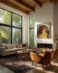 Red tail hawk framed canvas print over fireplace in modern living room with large windows