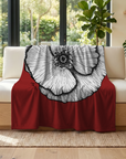 Color pop painting by Kris Horton of a poppy flower with a red background printed on a fleece blanket over a couch in living room