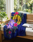 The color of happiness painting by Kris Horton printed on a fleece blanket on a window seat