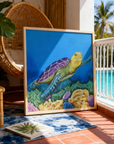 Framed painting by Kris Horton 'Sea of Colors' a turtle swimming above coral leaning on a patio near a pool.