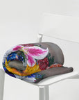 Painting Cross in Bloom by Kris Horton on a blanket that is rolled up