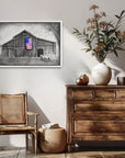Living room with wooden furniture and a framed painting of a rustic barn, old truck and an American flag by Kris Horton
