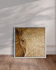 White framed artwork by Kris Horton of Strength & Honor a close up of an elephant's head in sepia.