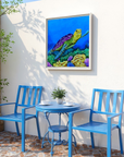 Blue outdoor furniture set with framed painting by Kris Horton of a turtle on a wall.