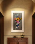 Framed floral painting of Cross in Bloom a cross made of flowers on a wall above a wooden cabinet hall.