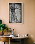 Bound painting by Kris Horton framed canvas print hanging on wall above kitchen table.