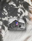 Magnet with the painting My America on it by Kris Horton, an old barn and truck in black & white with an American flag in color.
