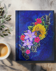 The Color of Happiness painting by Kris Horton on the cover of a hardback journal