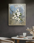 The Dogwood painting by Kris Horton framed hanging above a kitchen table.