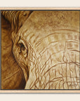 Framed artwork by Kris Horton of an elephant's head with a textured skin in sepia.
