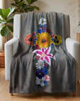 blanket with painting Cross in Bloom painting by Kris Horton printed on it, draped over a chair in a living room