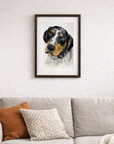 Framed custom pet portrait of a dog created by Kris Horton above a sofa in a living room setting.