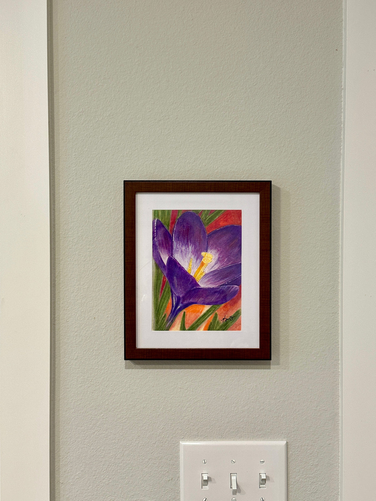 Purple crocus flower painting by Kris Horton hanging on a wall.