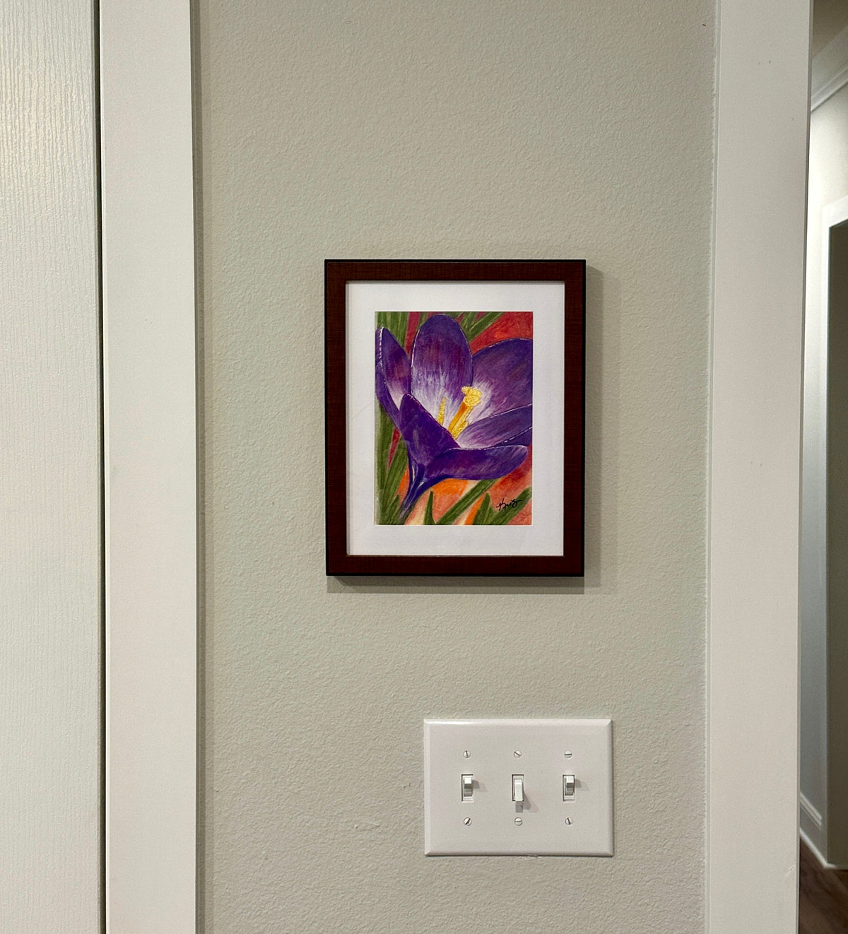 Crocus flower painting by Kris' Artworks framed and hanging on a wall.