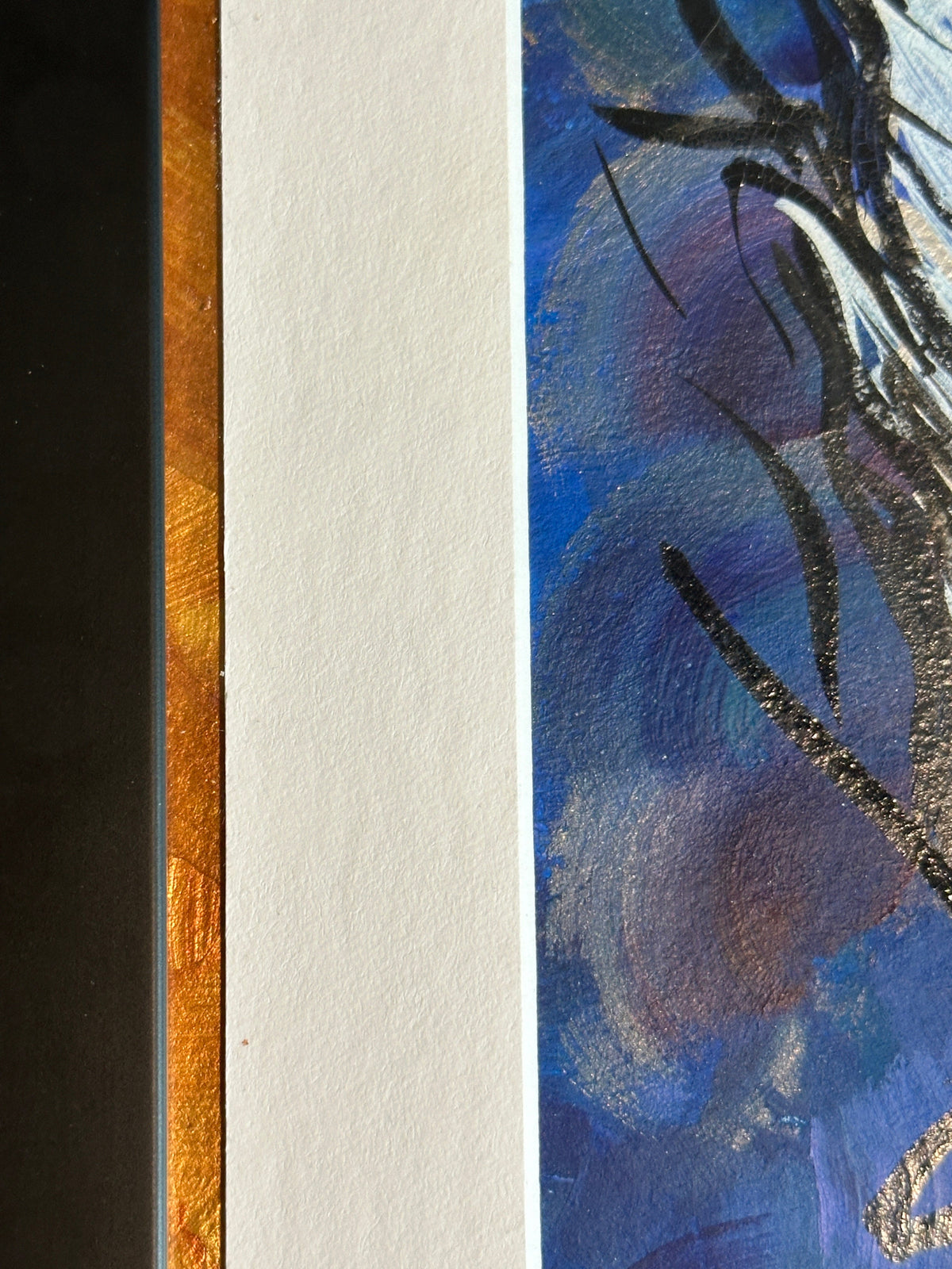 Close up detail of the copper and gold metallic between the frame and the white matting of the painting 'A Feathered Thought' by Kris Horton.