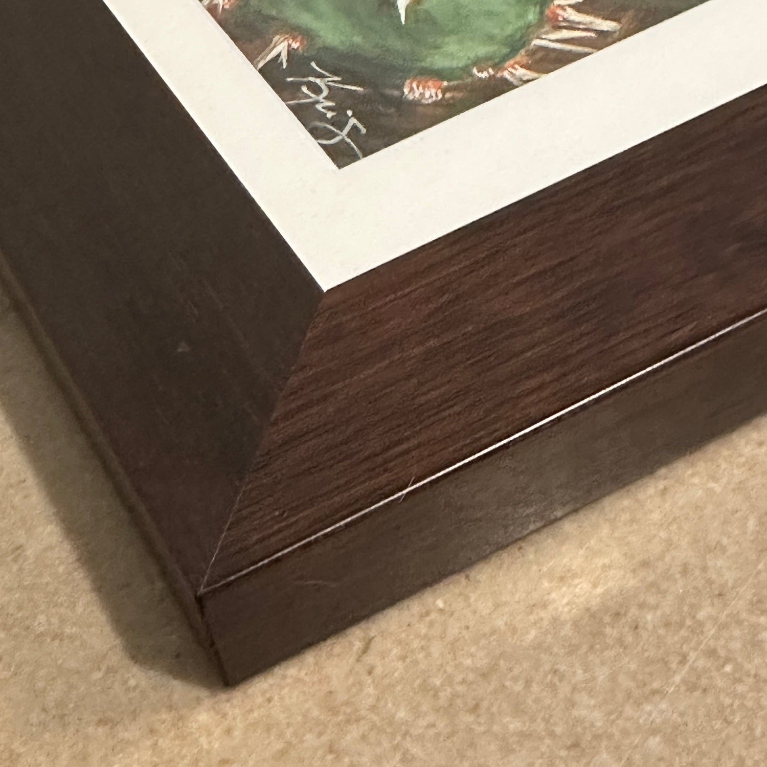 Close up of corner of framed original painting by Kris Horton of a cactus bloom