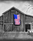 Black and white painting by Kris Horton of an old barn and truck with an American flag in color.