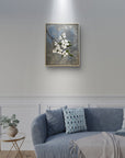Original painting of a dogwood branch and flowers with an abstract background hanging above a couch