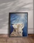 Black framed painting by Kris Horton of a bobcat displayed leaning against a wall.
