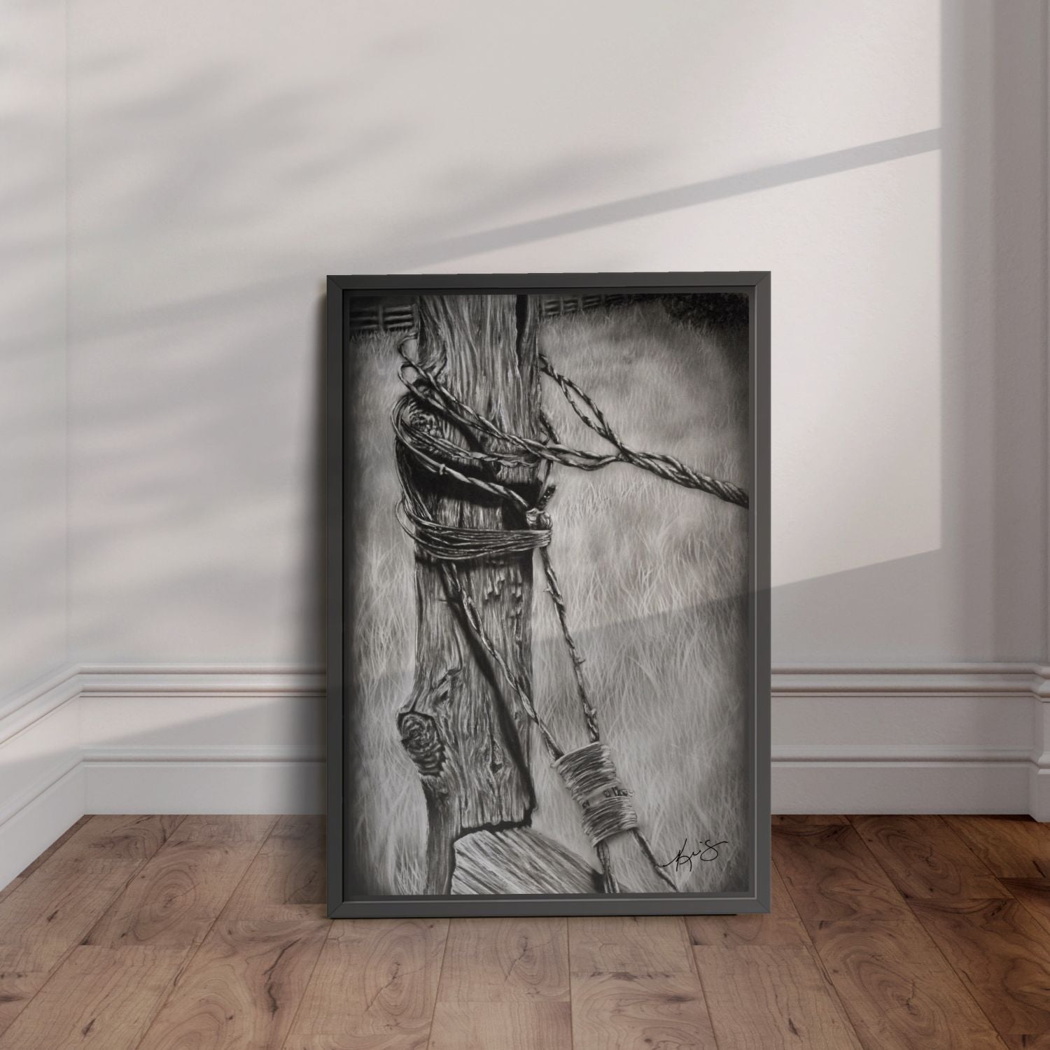 black framed artwork of Bound - a black and white painting of an old fence post wrapped in barb wire.