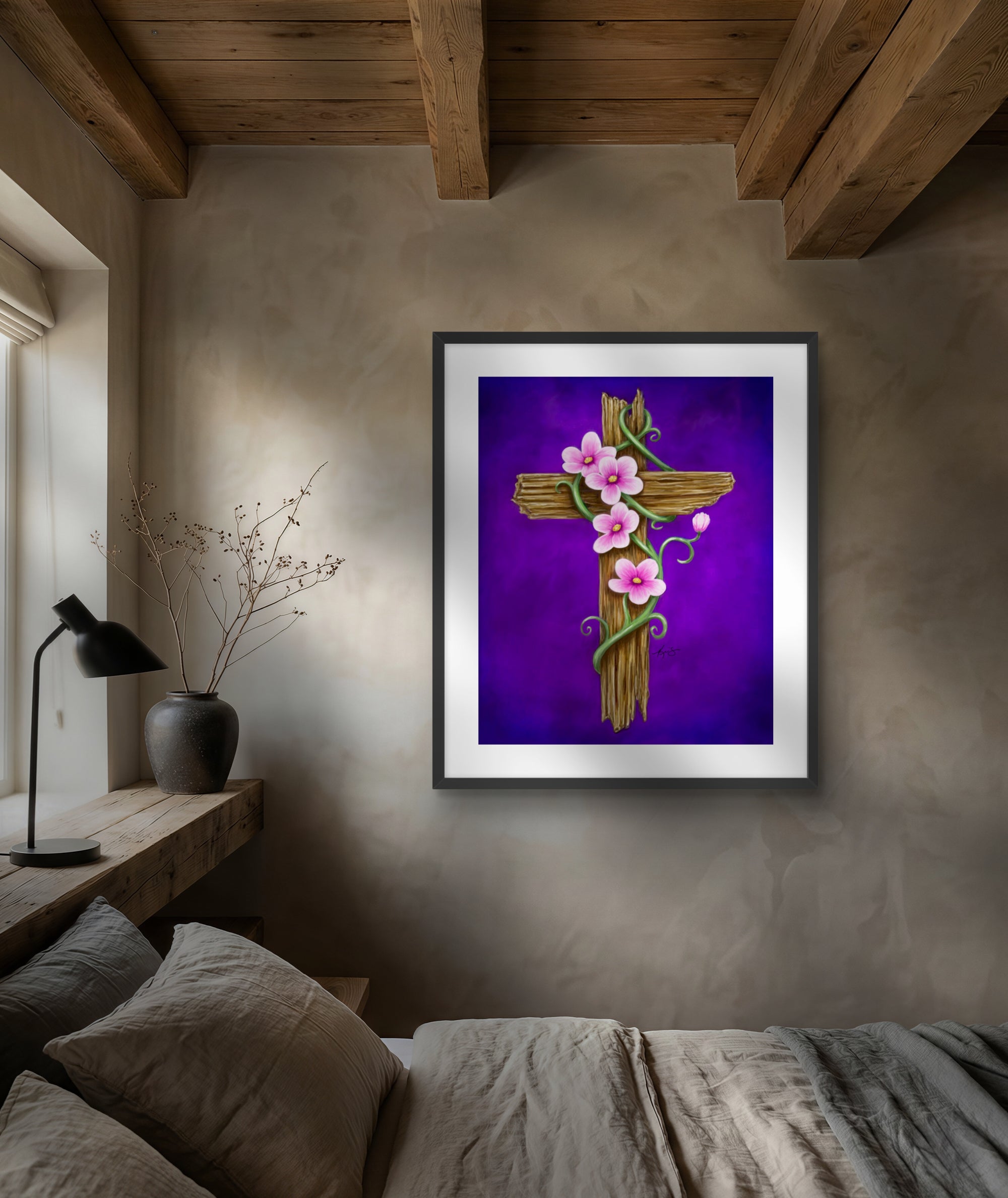 Framed artwork of a rustic cross with flowers on a wall above a bed in a bedroom.