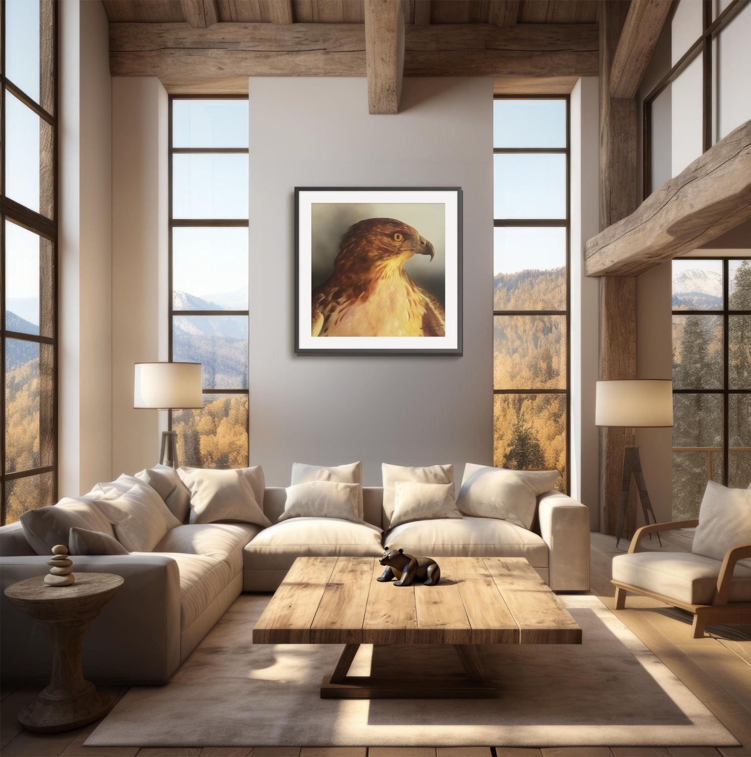 Framed painting of a hawk in a modern rustic living room with large windows and scenic view.