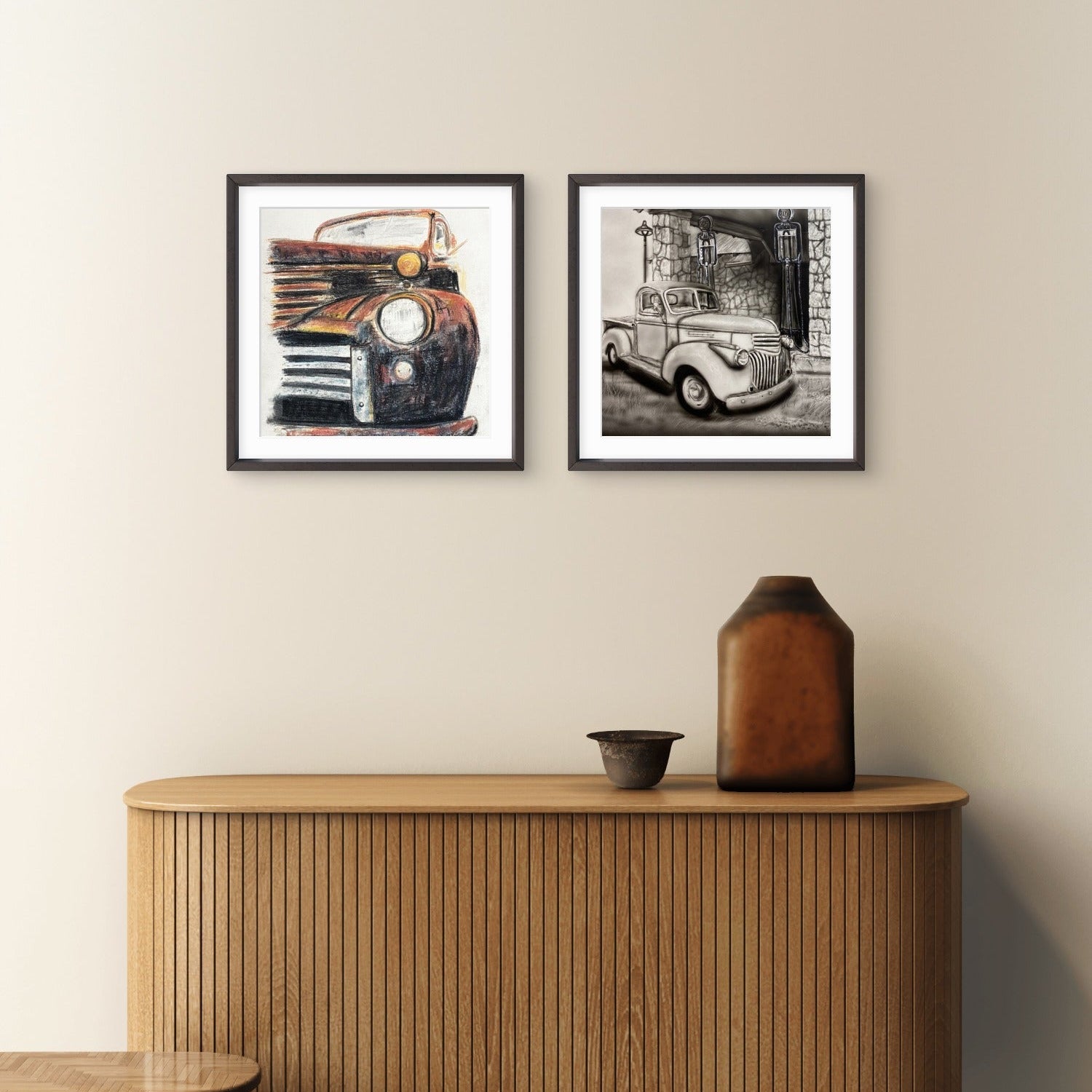 Two framed mini print pictures of vintage cars on a wall above a wooden cabinet paintings by Kris Horton