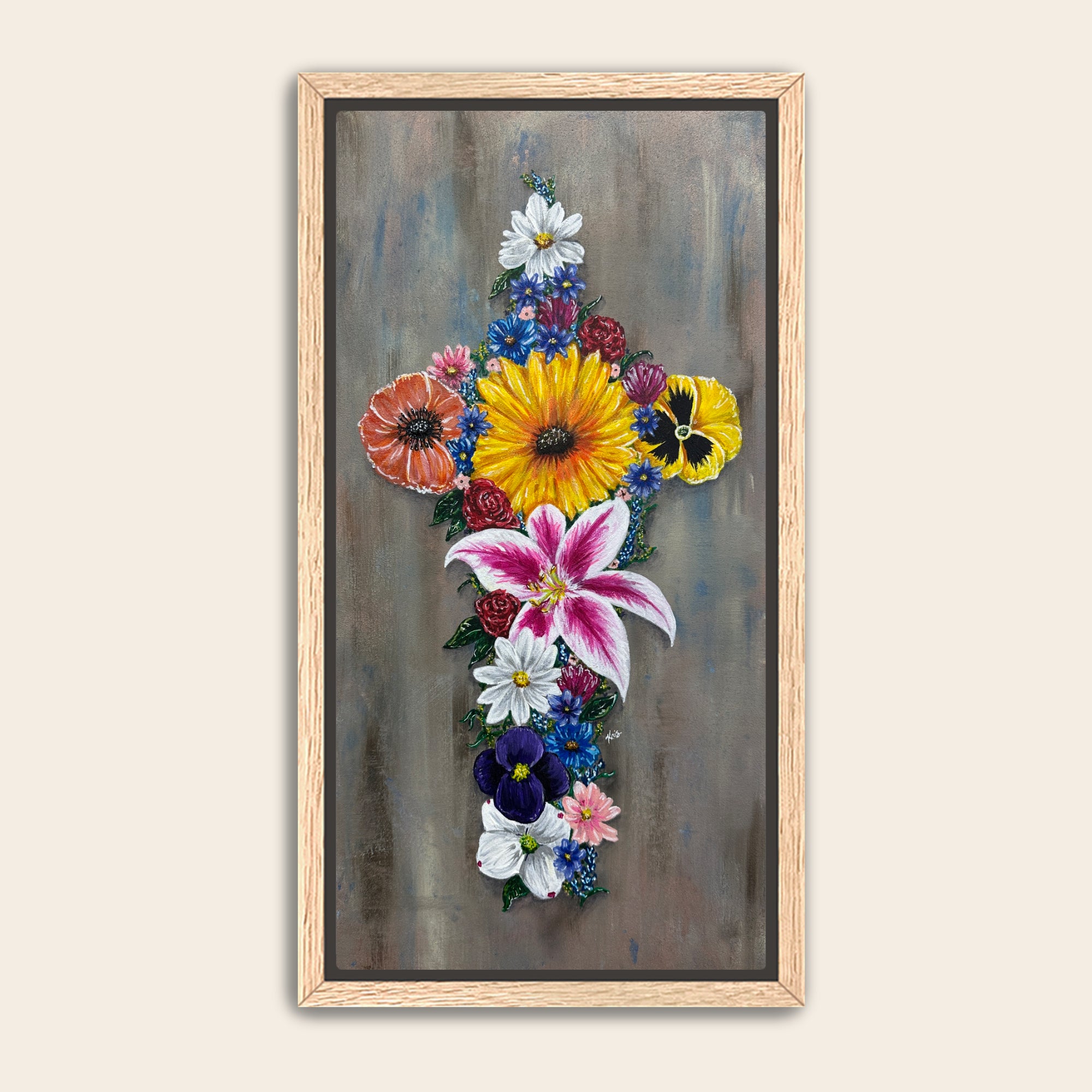 Framed artwork of a cross made of colorful flowers with a grey background.