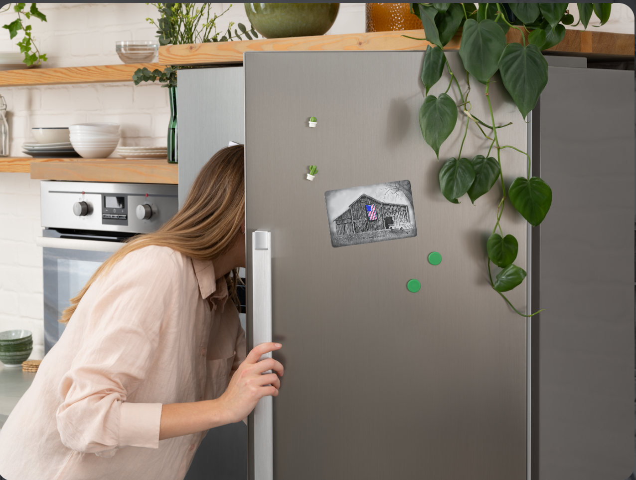 The magnet with the My America painting on a refrigerator.