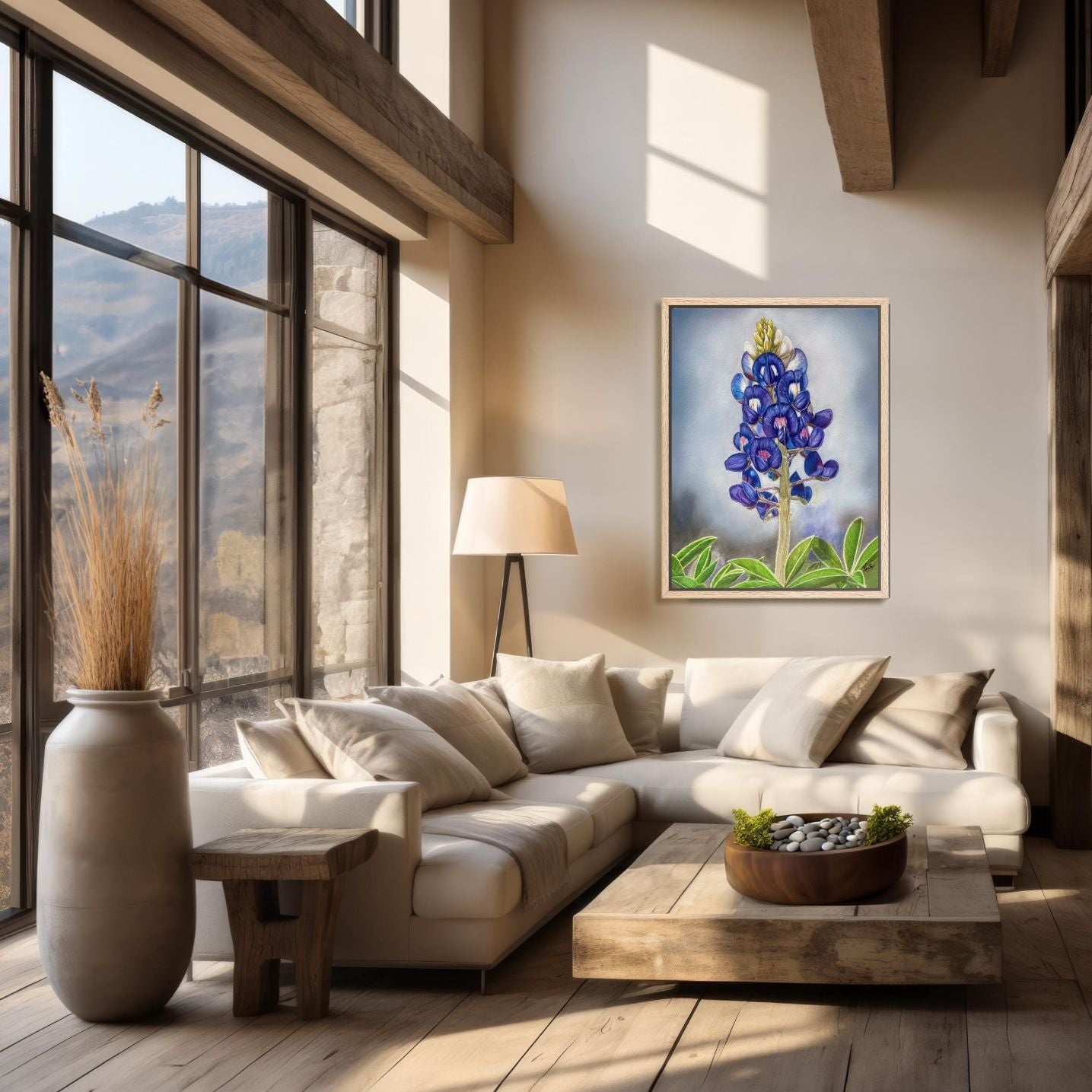 Modern living room with a sectional sofa, coffee table, and wall art of a painting of a bluebonnet by Kris Horton.
