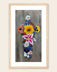 Framed artwork of a floral cross on a neutral background