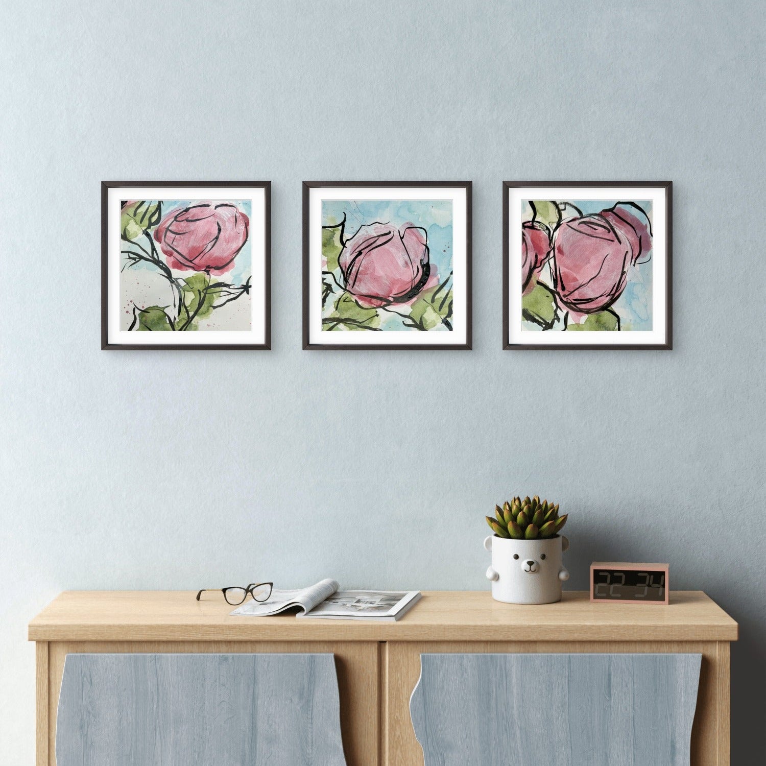 Quiet Bloom abstract roses mini print set by Kris Horton framed and hanging above console table