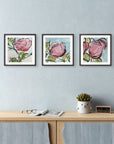 Quiet Bloom abstract roses mini print set by Kris Horton framed and hanging above console table