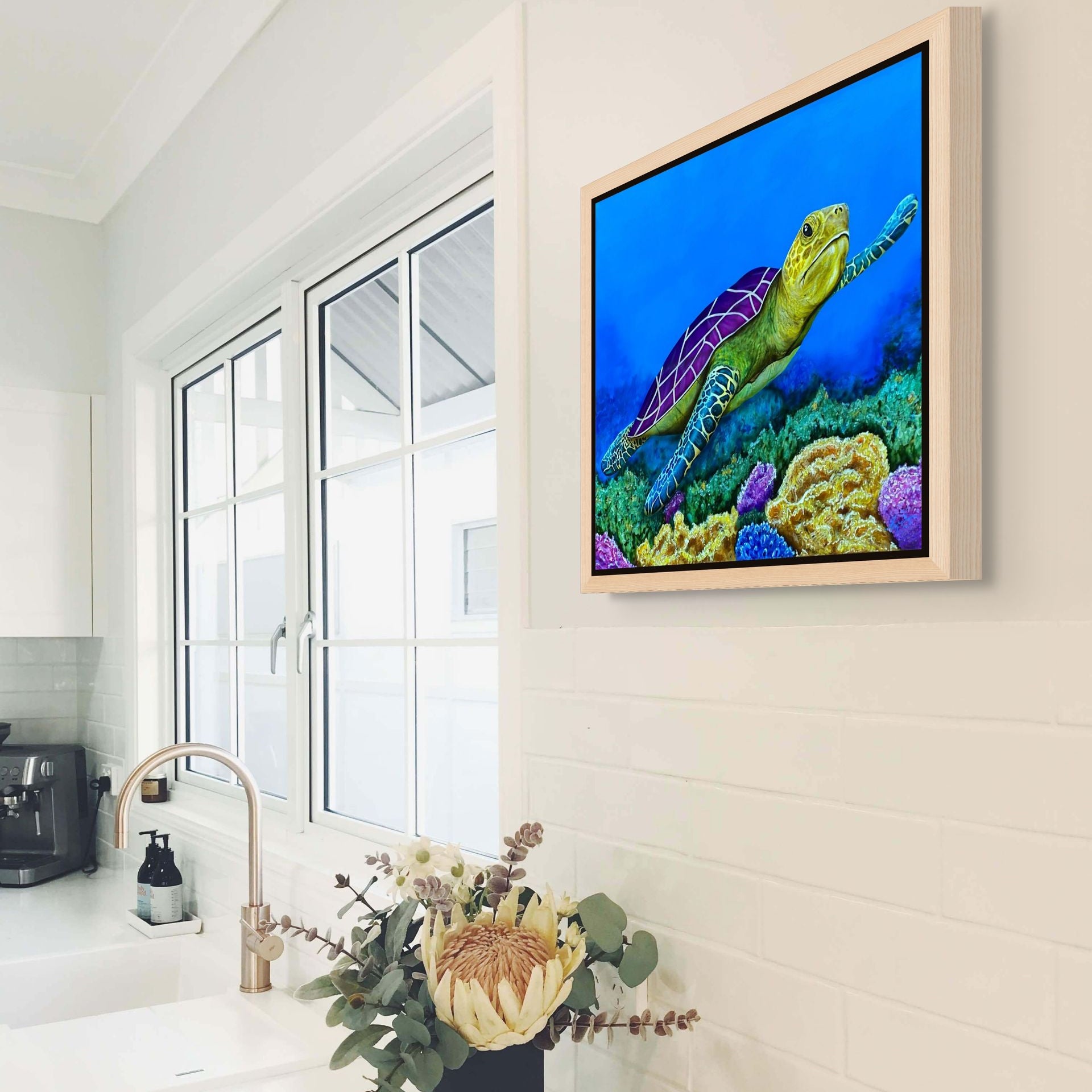 Framed canvas print of Sea of Colors, a painting by Kris Horton, a vibrant sea turtle swimming in the ocean.