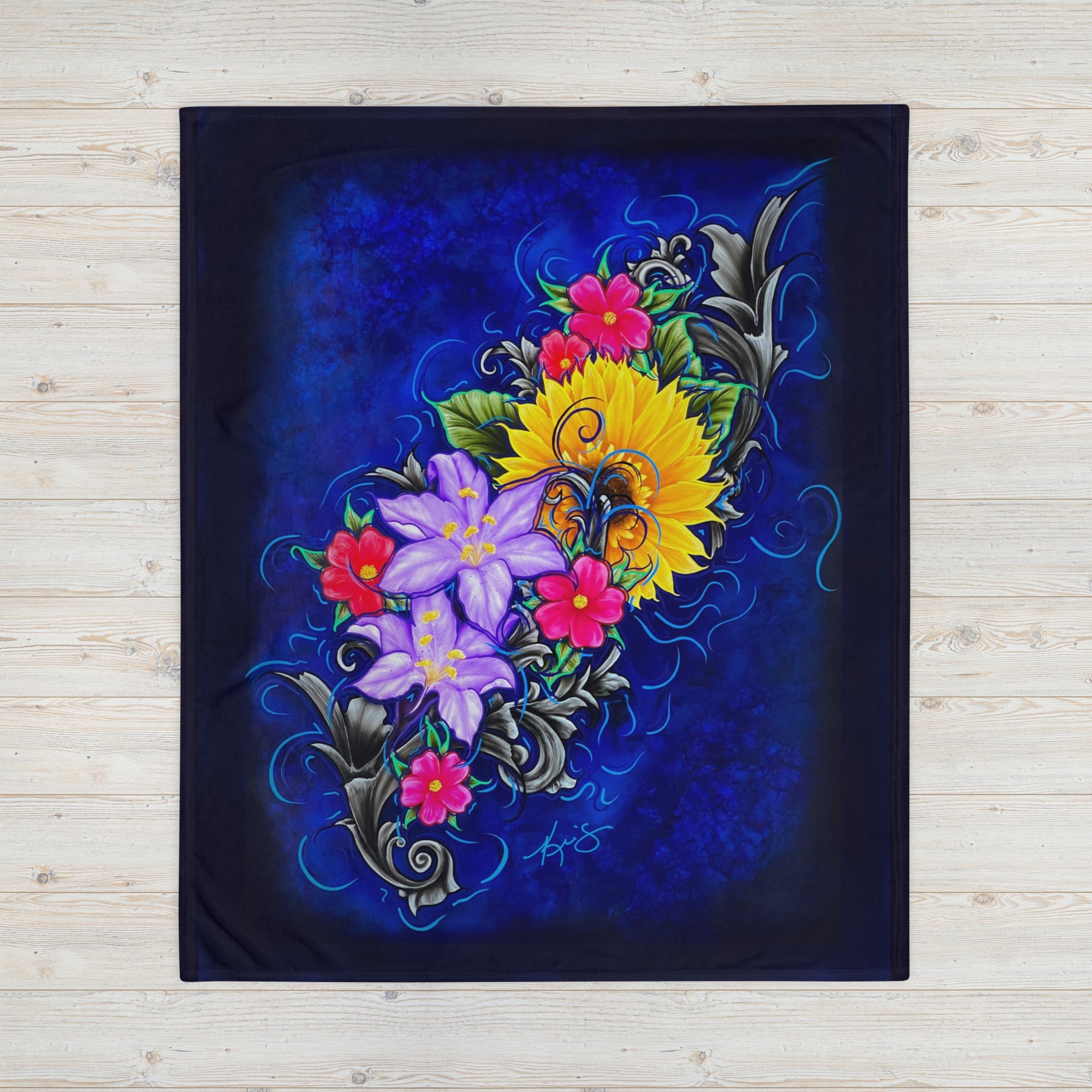 Colorful floral design on a dark blue background on a blanket painted by Kris Horton