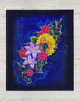 Colorful floral design on a dark blue background on a blanket painted by Kris Horton