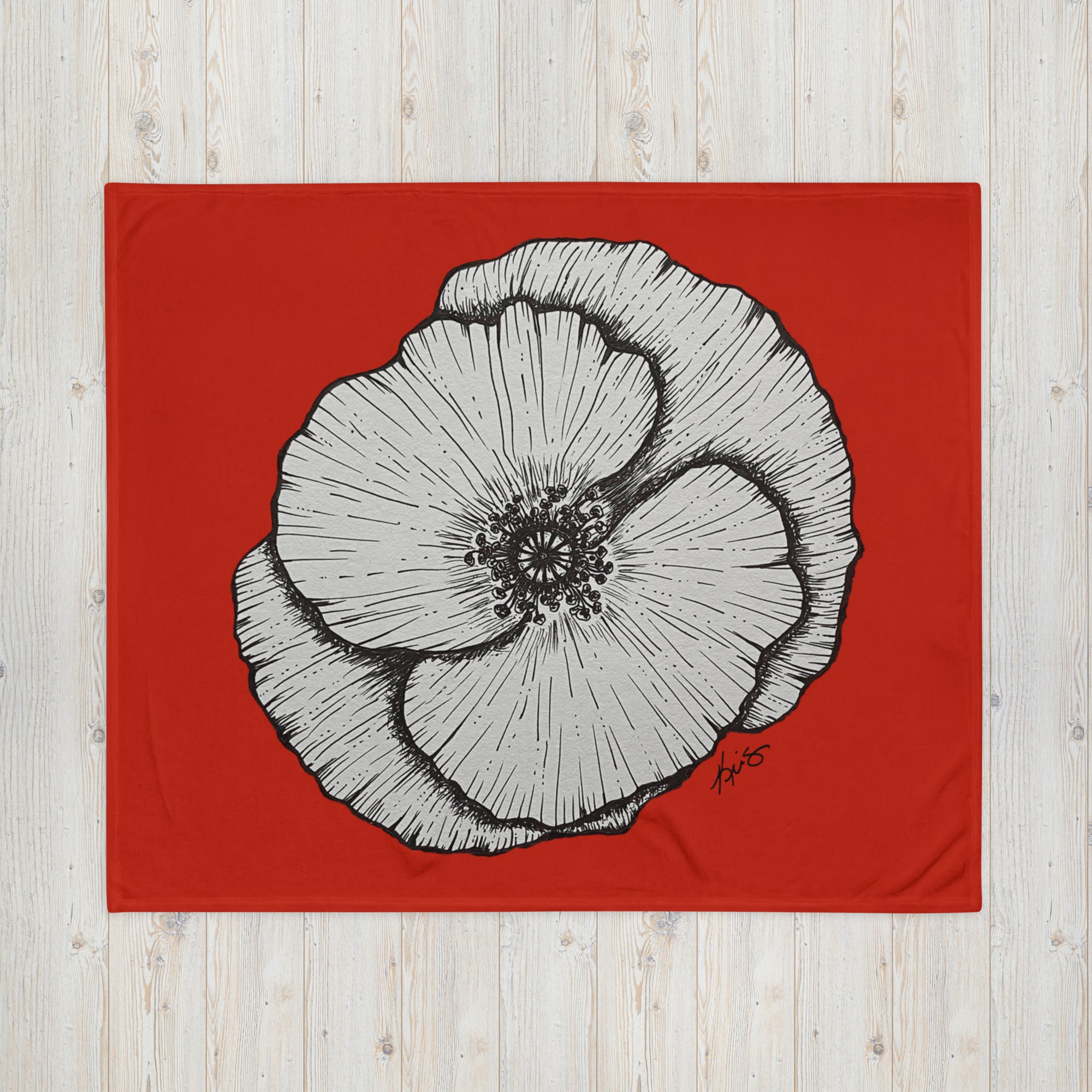 Black ink drawing of a poppy with a red background by Kris Horton on a throw blanket