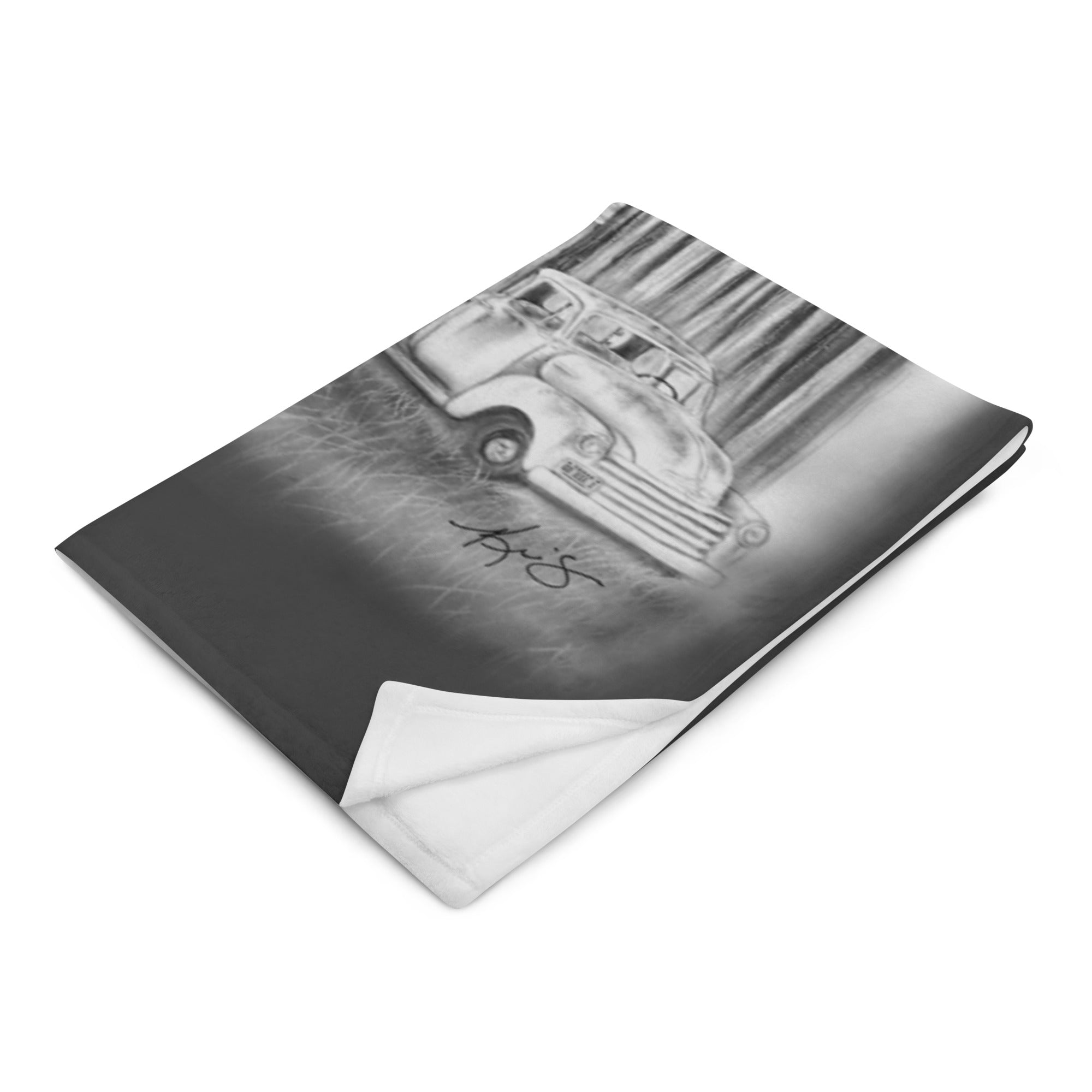 Blanket with a black and white illustration of a vintage truck on a white background