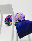 Colorful folded blanket with floral design by Kris Horton