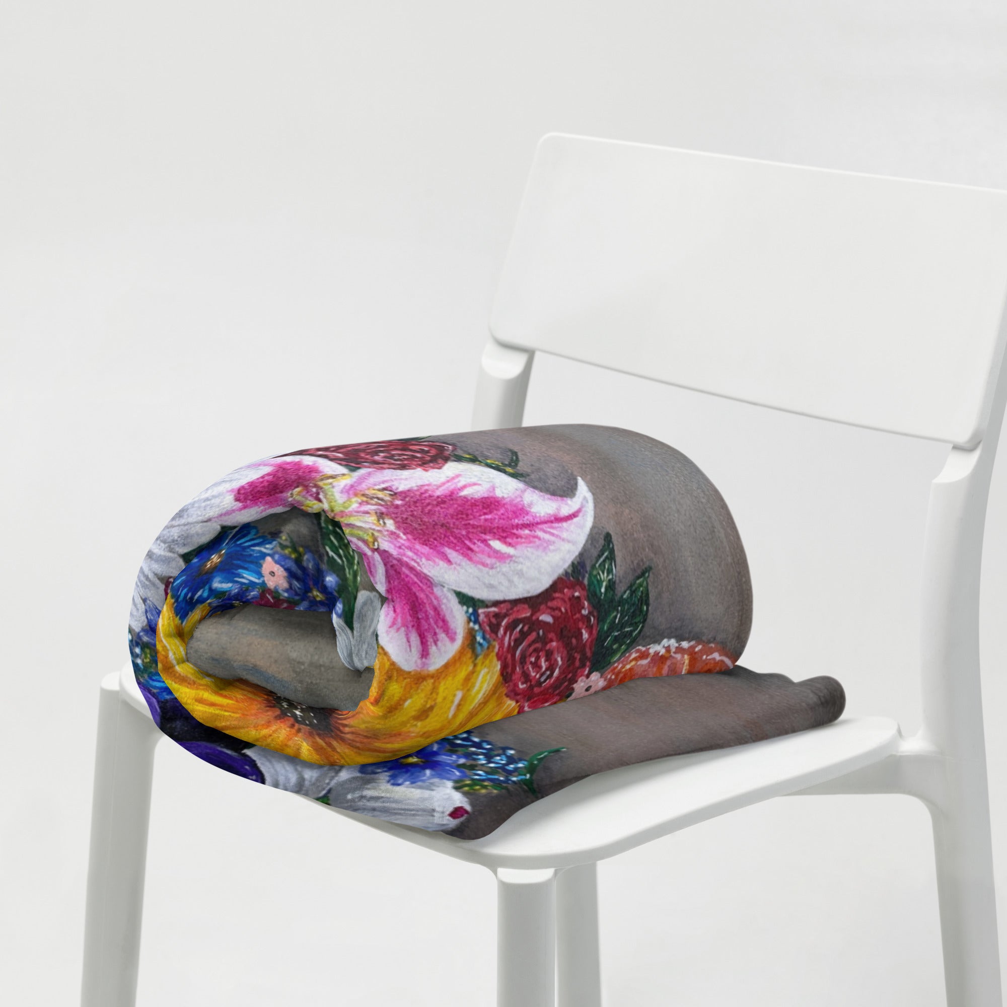 Painting Cross in Bloom by Kris Horton on a blanket that is rolled up