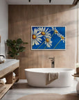 Daisy Days daisy painting by Kris Horton styled in a modern bathroom above a white sink.