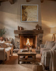 Framed wall art by Kris Horton of a close up of an elephants eye in sepia hanging above a fireplace in a cozy living room.