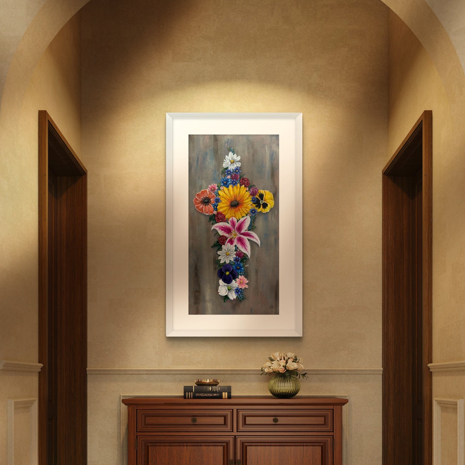 Framed floral painting of Cross in Bloom a cross made of flowers on a wall above a wooden cabinet hall.