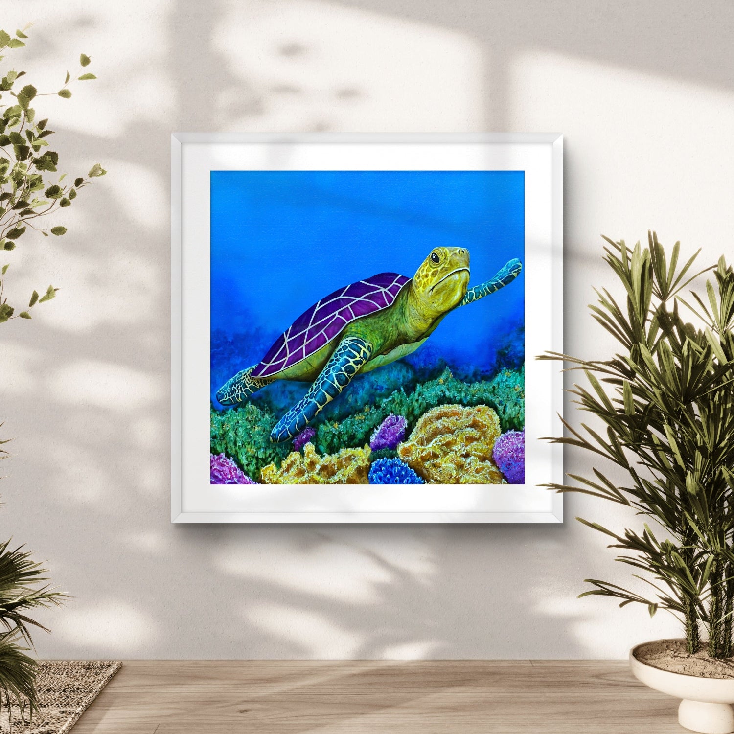 Framed artwork by Kris Horton of a turtle on a coral reef in a home setting with plants.