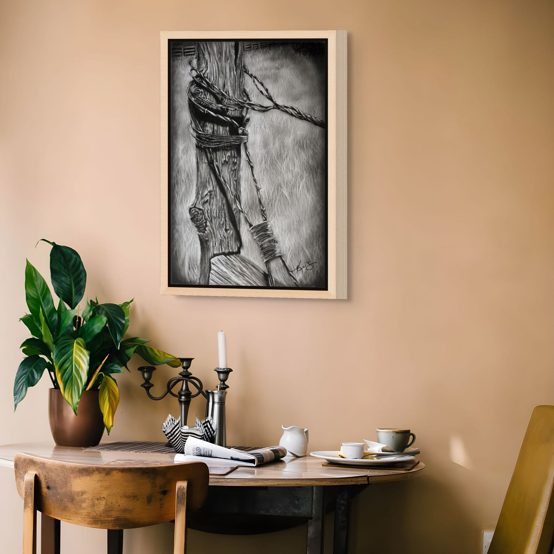 Bound painting by Kris Horton framed canvas print hanging on wall above kitchen table.